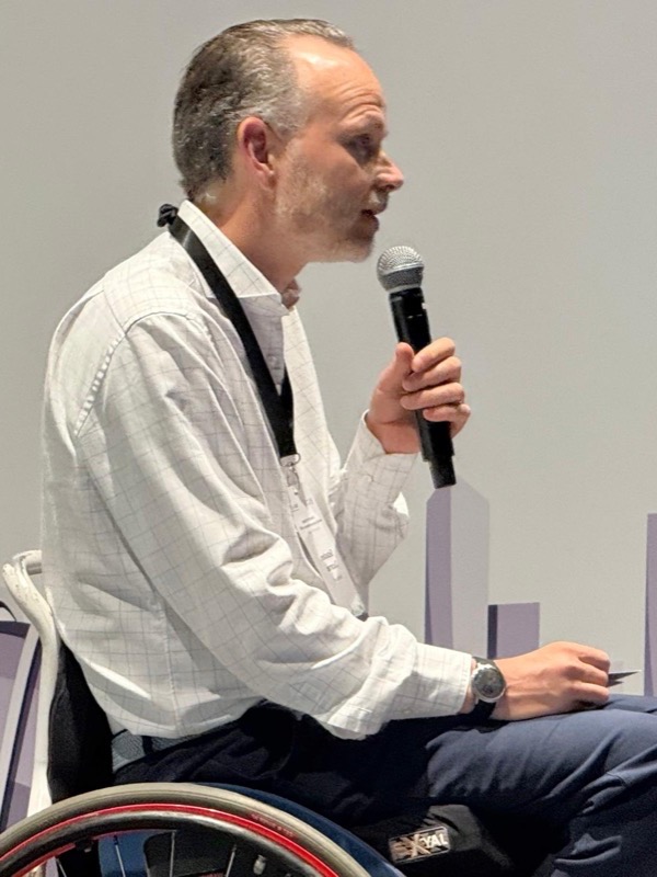 Seb speaking at a conference